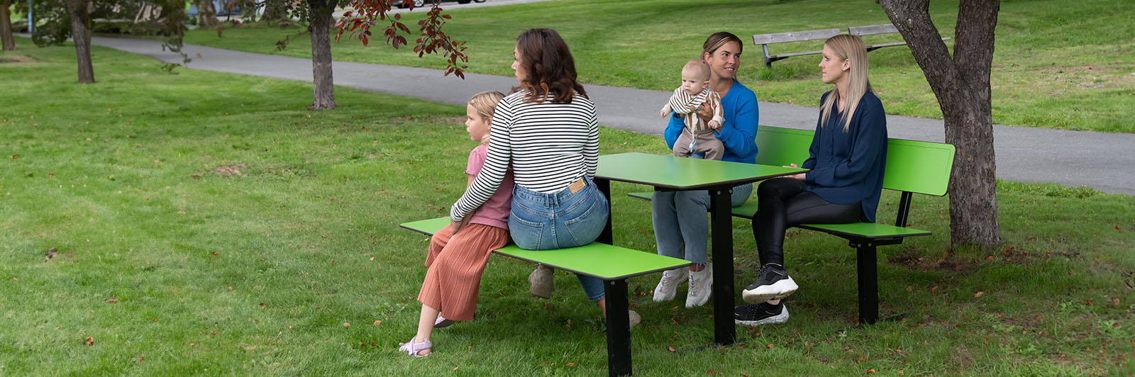 Firend hanging out at a local park on HPL Benches